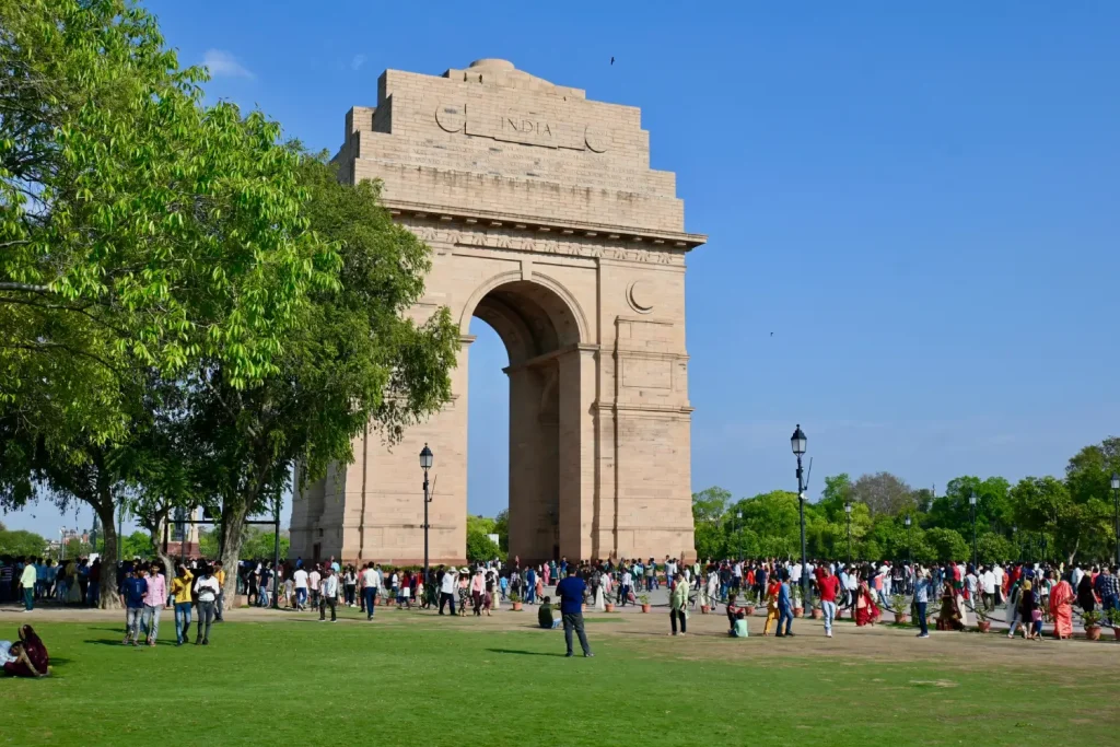 India Tour Packages 3 "India Gate with tourists enjoying an India Group Tour, provided by Travel with Vasco, during their memorable India tour service."