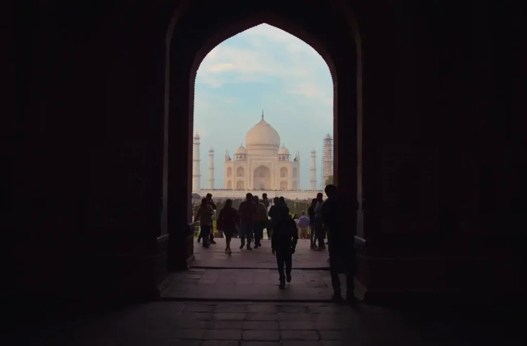 India Tour Packages 8 "View of the Taj Mahal through an archway, captured during an India Group Tour as part of the Golden Triangle Tour with Travel with Vasco."