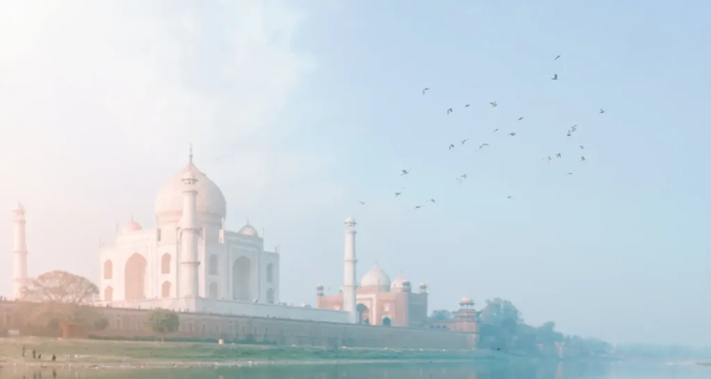 India Tour Packages 9 The Taj Mahal at sunrise during an India Group Tour arranged by Travel With Vasco, showcasing its breathtaking beauty and serene surroundings.