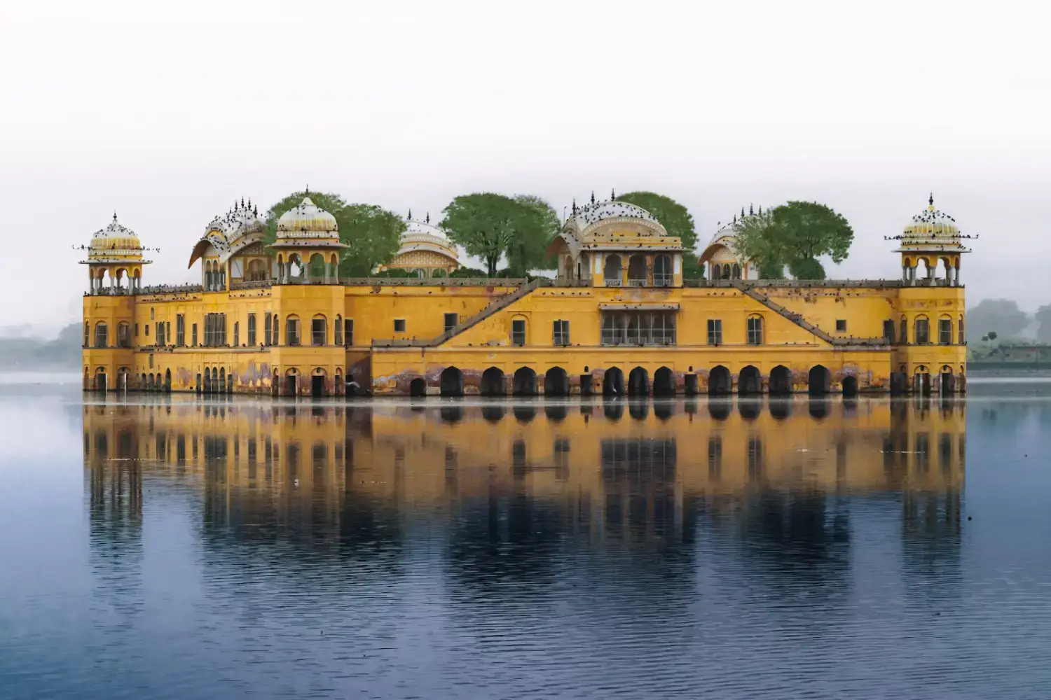 What’s the best way to get around Jaipur? 1 Jal Mahal, Jaipur - a beautiful water palace located in Rajasthan, India, visited during an India Group Tour organized by Travel With Vasco.
