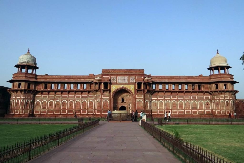 India Tour Packages 4 Guests from Travel with Vasco’s India Group Tour exploring the historic Agra Fort, a key highlight of the Golden Triangle Tour.