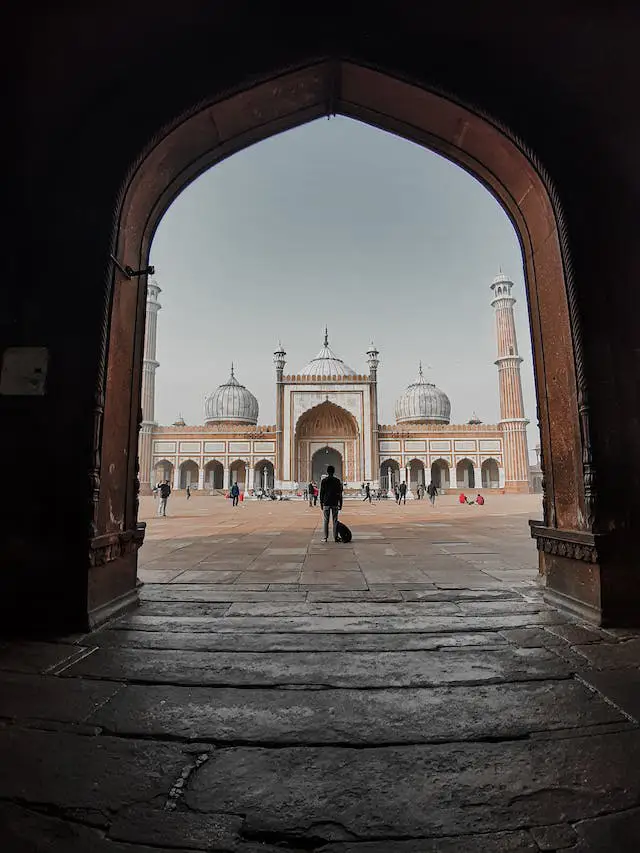 Jama Masjid in Delhi, India, viewed through a grand archway, visited by Travel with Vasco's guests during their India Group Tour.
