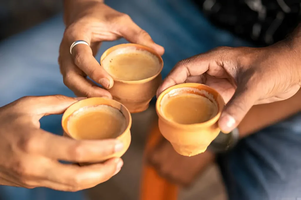 Traditional Indian Food: Must-try dishes when visiting India 9 Clay tea cup being hold in the hand