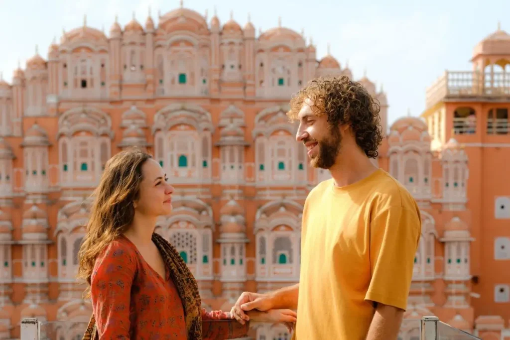 10 Most Romantic Destinations in India 4 Couple standing on balcony in front of Hawa Mahal, Jaipur
