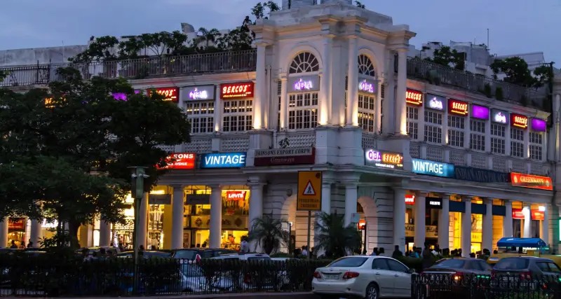 Evening view of Connaught Place, a bustling shopping and dining hub in New Delhi, India, visited during an India Group Tour organized by Travel with Vasco.