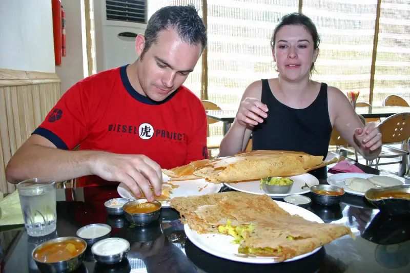 Is Jaipur safe for tourists? 2 "Guests of Travel With Vasco enjoying authentic South Indian cuisine during their India Group Tour as part of the Golden Triangle Tour experience."