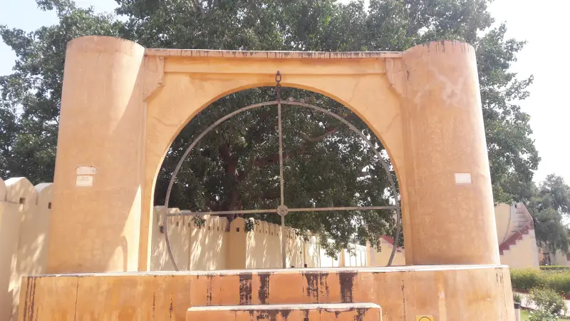 Jantar Mantar Astronomical Observatory 1 "Unnatamsa Yantra at Jantar Mantar in Jaipur, India—a circular astronomical instrument used to measure the altitude of celestial bodies, set against a backdrop of trees and stone walls."